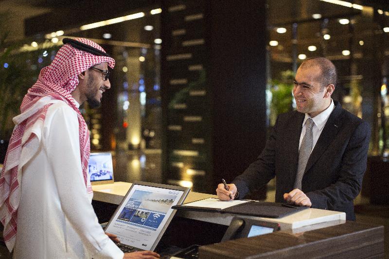 Rosh Rayhaan By Rotana Hotel Riyadh Exterior photo A guest checking in at a hotel